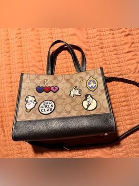 Coach X Disney Dempsey Carryall with signature “Bag Girls Club” patches.